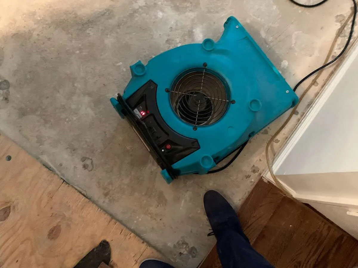 Air mover drying subfloor during Commercial Water Damage Restoration in Loudoun Valley Estates